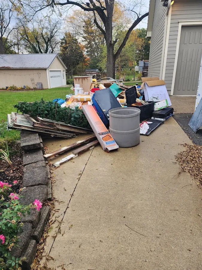 Dumpster being loaded with debris for Commercial Dumpster Rental in Scott City